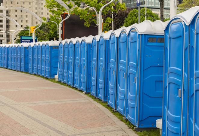 a row of portable restrooms for a special event, ensuring guests have access to clean facilities in Fresno